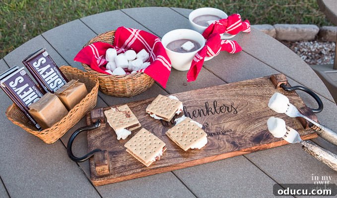 Craft Your Own S'mores Roasting Sticks 2 A beautifully presented s'mores platter, showcasing golden-brown marshmallows, rich chocolate bars, and crisp graham crackers, ready for guests to assemble their own delicious treats. Perfect for holiday entertaining or campfires.