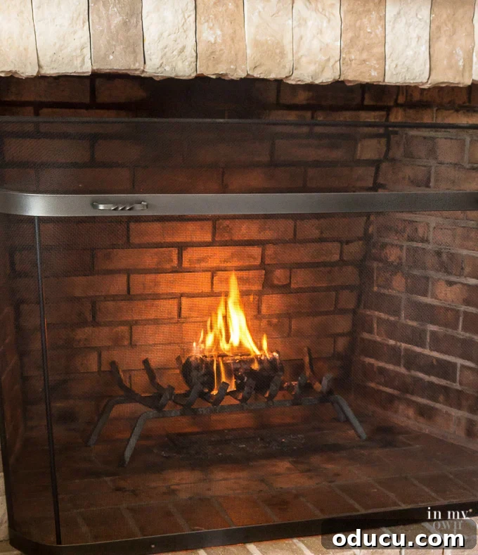 What does a Pine Mountain firelog look like when burning? A Pine Mountain firelog burning in a fireplace, showing its appearance during combustion.