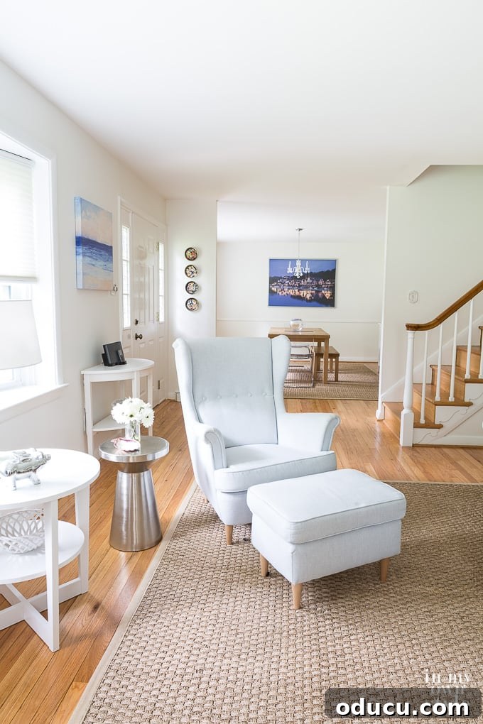 Illuminate Your Space: Easy Hacks for a Brighter Room 4 A beautifully decorated room featuring white walls, light-reflective flooring, and bright rugs, designed to maximize light and space.