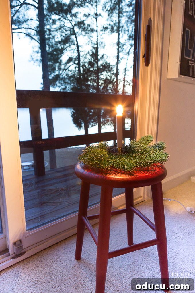 Simplifying Christmas Decorating by only adding the decorations that matter to your family A festive holiday tradition featuring candles in the window, symbolizing simplified Christmas decorating by focusing on meaningful elements.