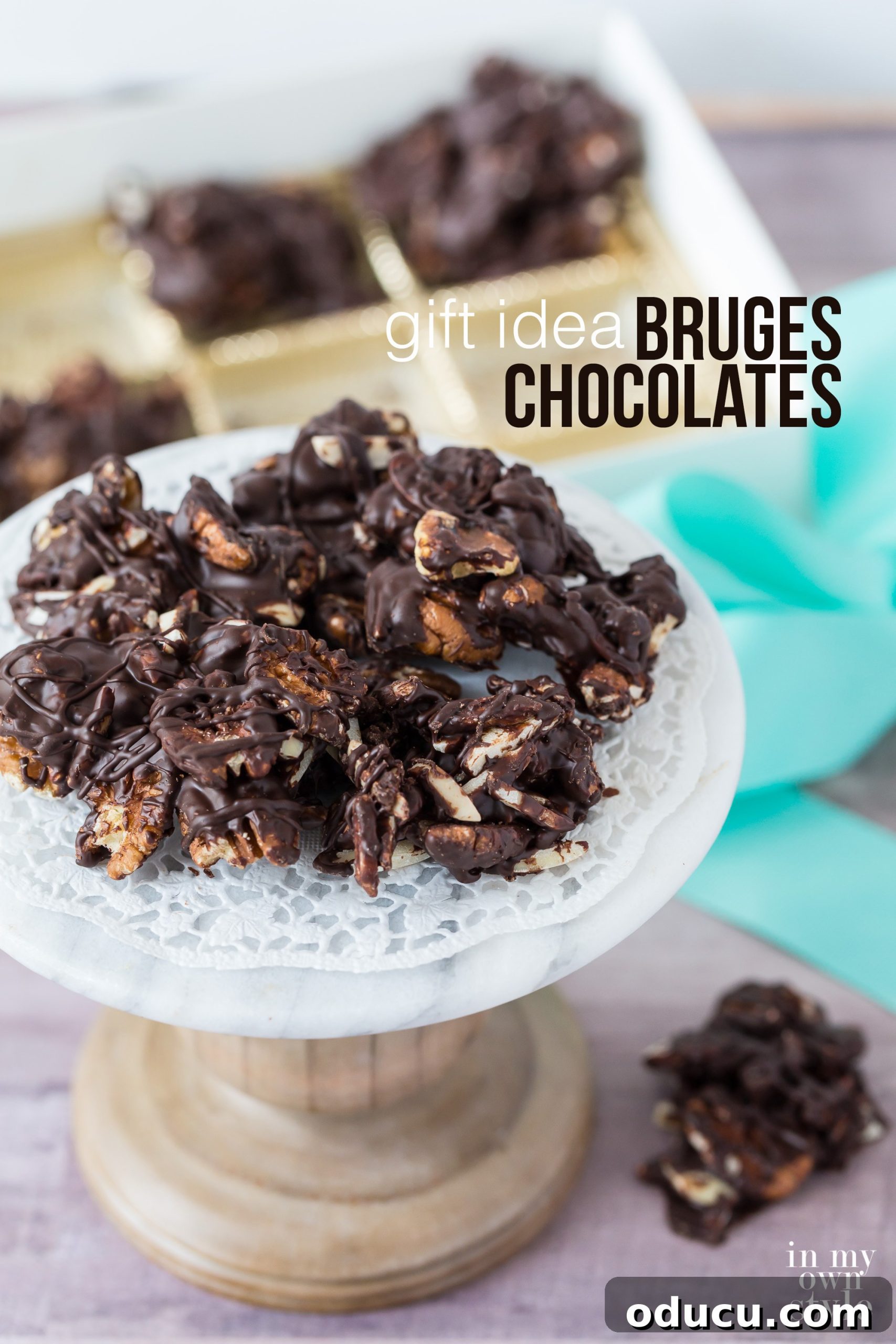 Edible gifts to give this year to family, friends, teachers, hostesses, and for corporate giving. Bruges Chocolaterie sells many types of delish chocolates that they beautifuly package to be sent anywhere. The chocolate is so much better than any mass marketed chocolate you buy at the mall. #chocolate #giftideas #holidaygifts #corporategifts #ediblegifts #christmasgiftideas A selection of gourmet edible gifts from Bruges Chocolaterie, including various chocolates and packaging, ideal for holiday gift-giving