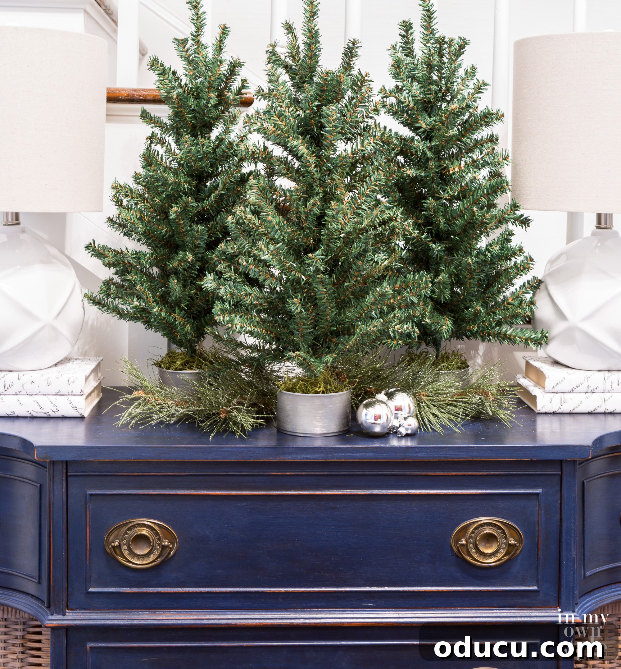 Tiny Tree, Big Style: Base Decor Hacks 10 Inspiring tabletop Christmas tree decorating ideas, creatively utilizing repurposed tuna cans as stylish and unique bases.