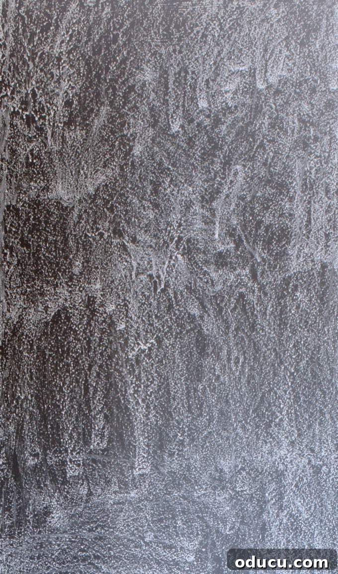 Prevent Ghosting: How to Season Your Chalkboard Wall Step-by-step process of seasoning a new chalkboard to prevent ghosting.