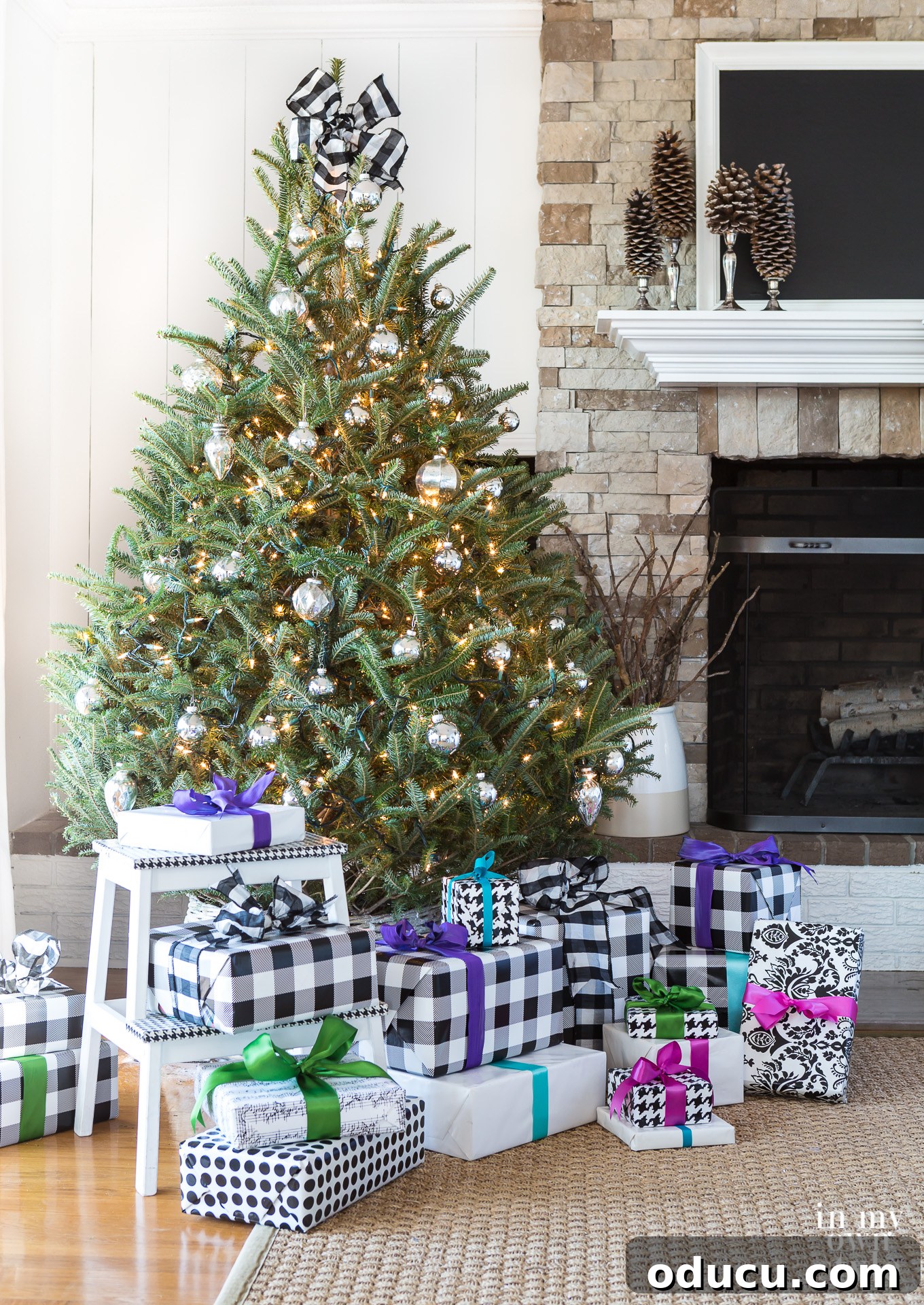 Beyond Baubles: Creative Tree Styling 12 Simply decorated real Christmas tree with white twinkle lights and silver mercury glass ornaments