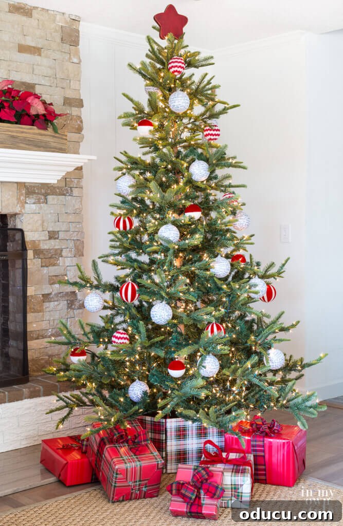 Beyond Baubles: Creative Tree Styling 6 Red accented Christmas tree with a star topper