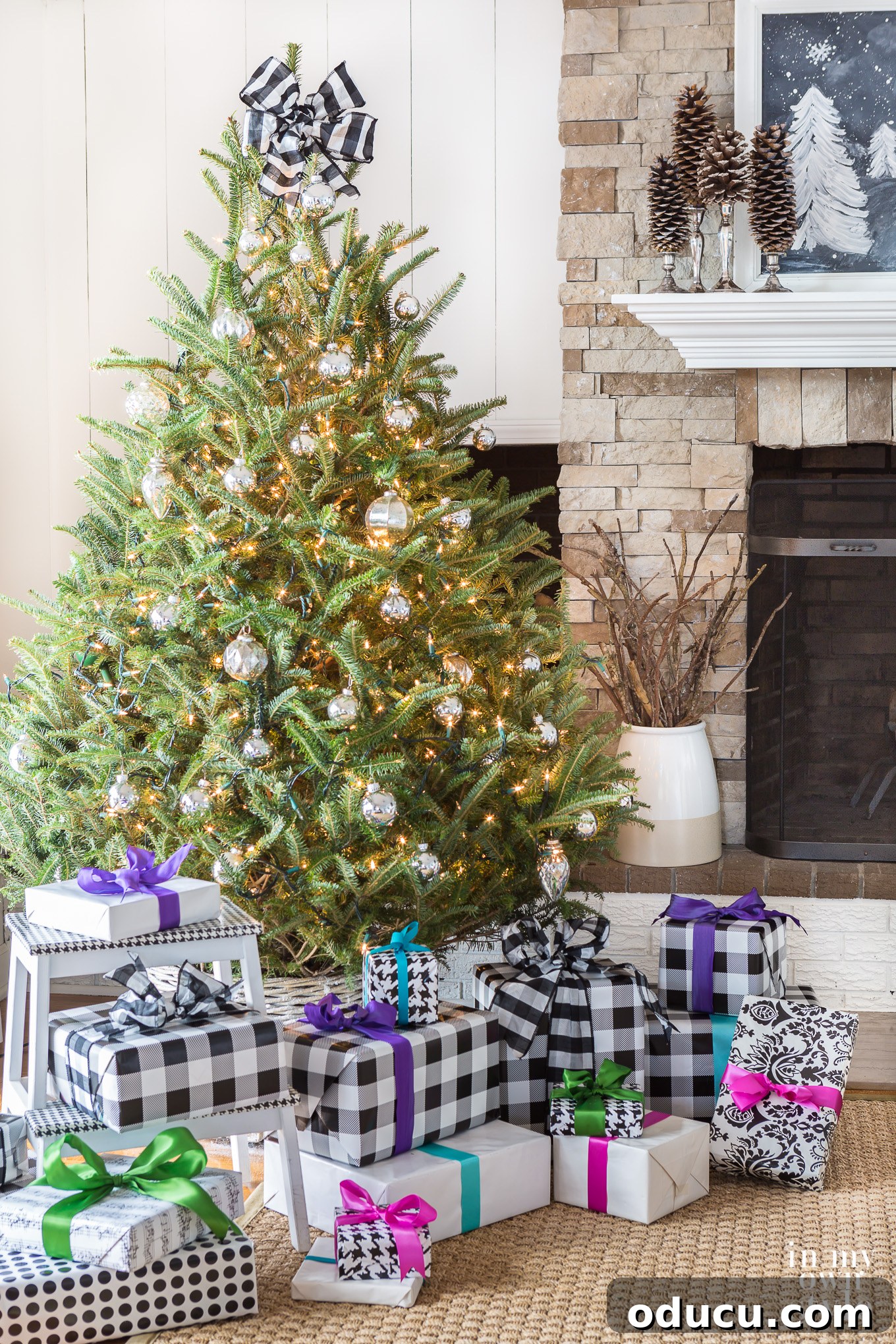 Colorful gift wrapped presents under a Christmas tree Colorful gift wrapped presents under a Christmas tree, hinting at vibrant joy within a neutral setting