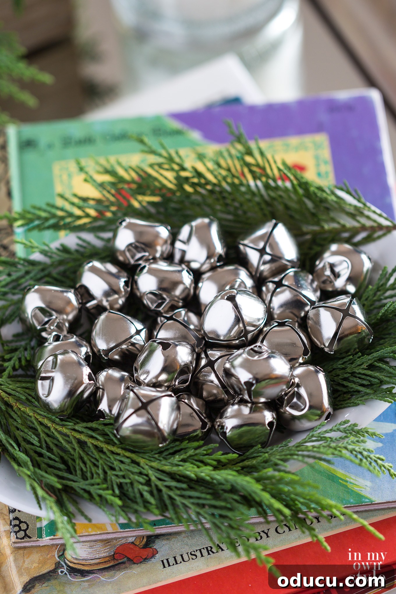 Deck the Halls: Inspiring Christmas Home Decor 2 A cluster of jingle bells and other neutral Christmas decor on a table