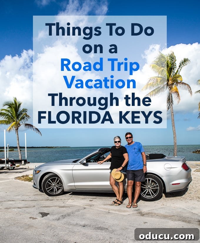 Keys Island Drive Adventure 25 Couple standing next to their convertible on U.S. Highway 1 in the Florida Keys, enjoying the view