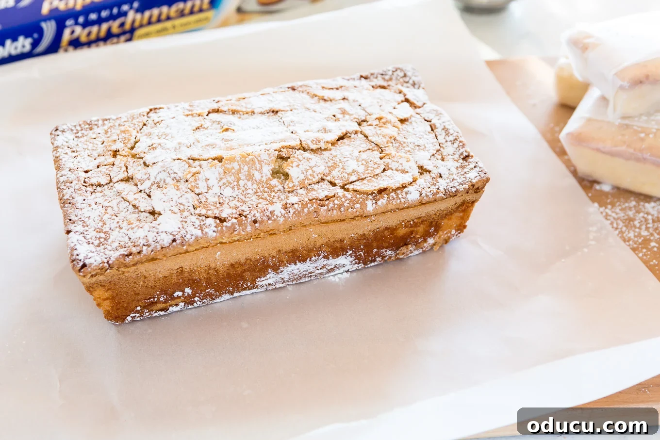 Elevate Your Loaf Cake Gifts with Festive Wrapping 3 Freshly baked Old Fashioned Lemon Pound Cake cooling out of the oven, ready for festive wrapping.