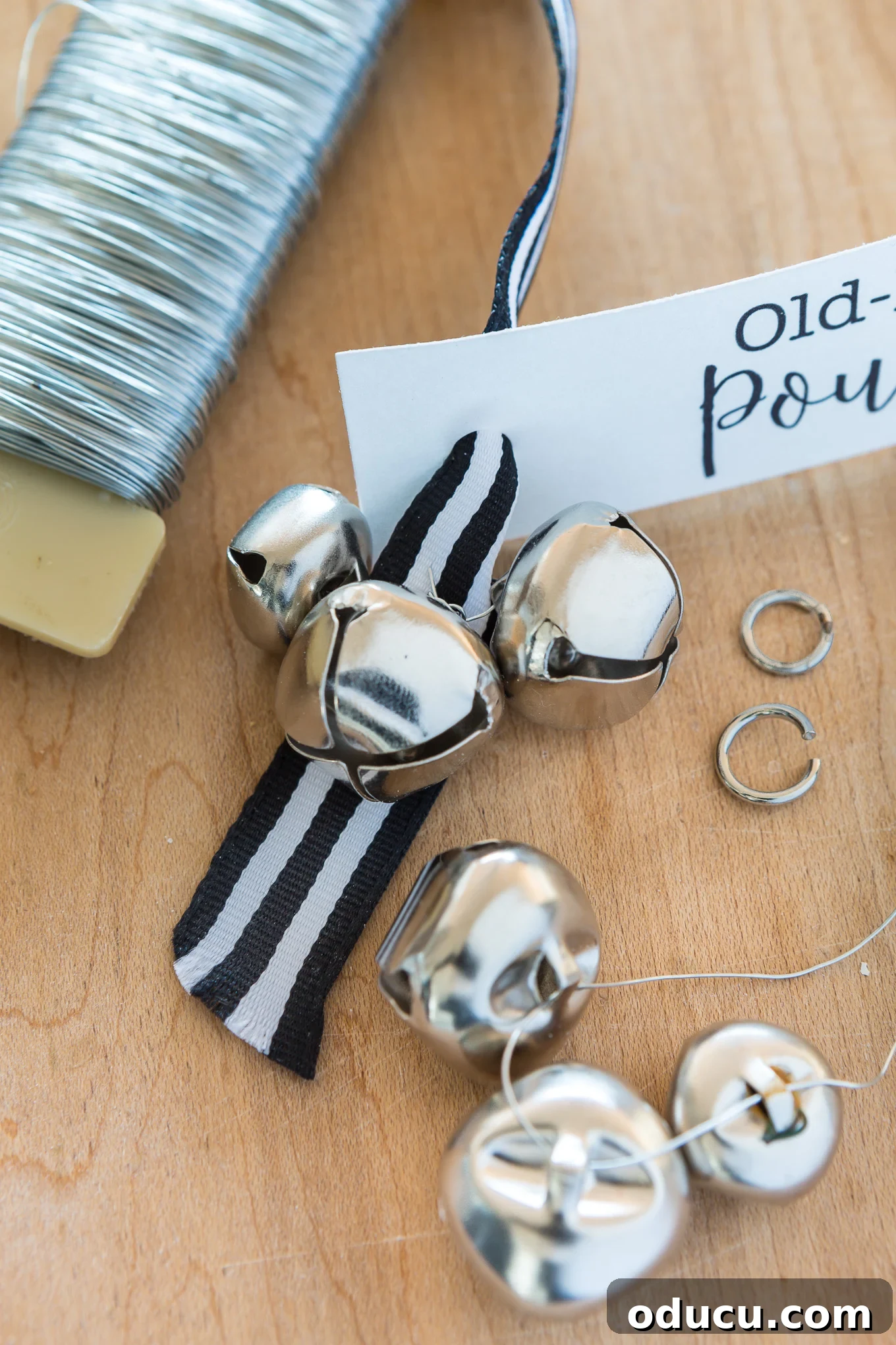 Elevate Your Loaf Cake Gifts with Festive Wrapping 6 Assembling the ribbon, gift tag, and jingle bells for a festive baked goods gift wrap.