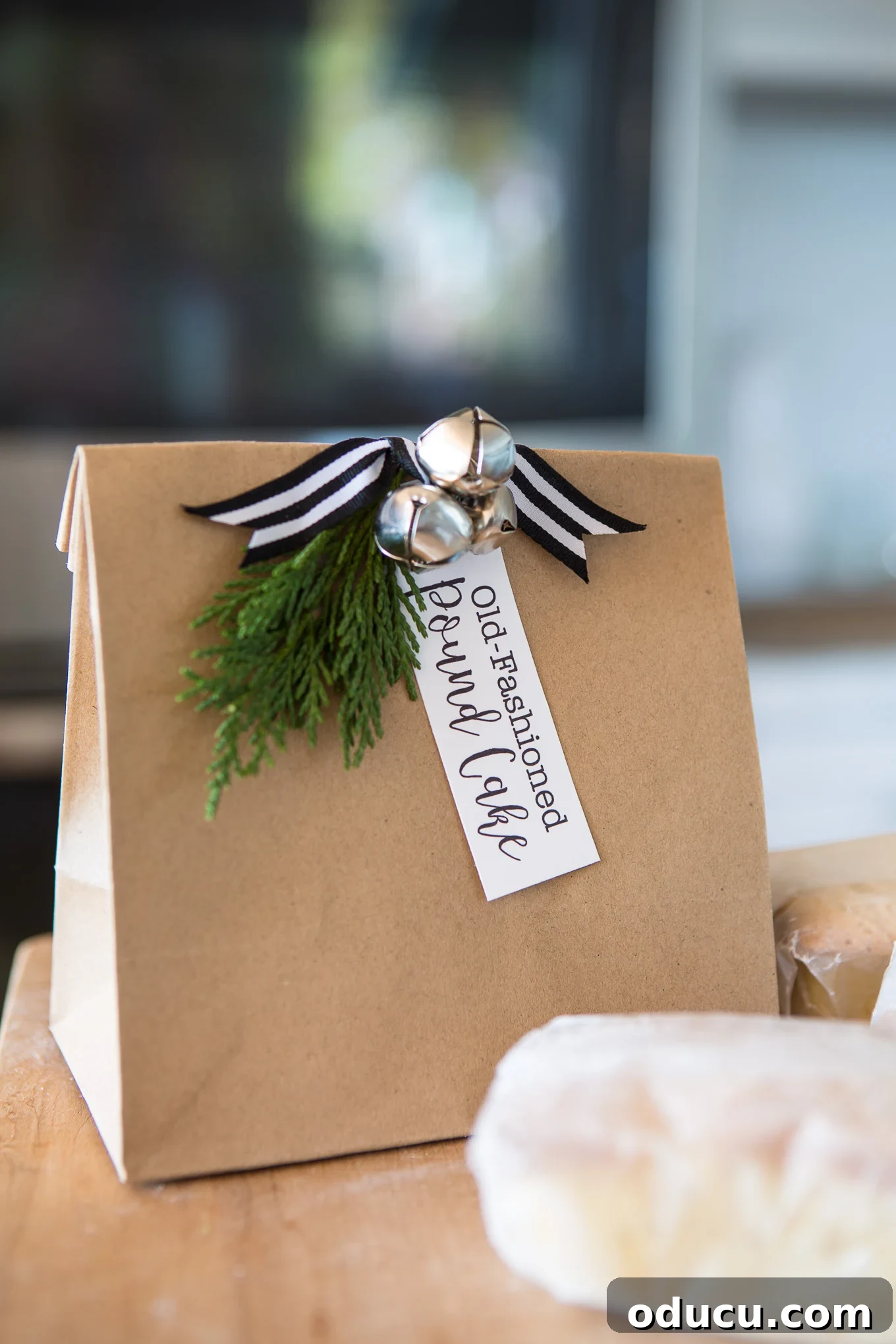 Elevate Your Loaf Cake Gifts with Festive Wrapping 10 Preparing brown paper bags for wrapping mini loaves of cake or bread, a simple yet effective method.