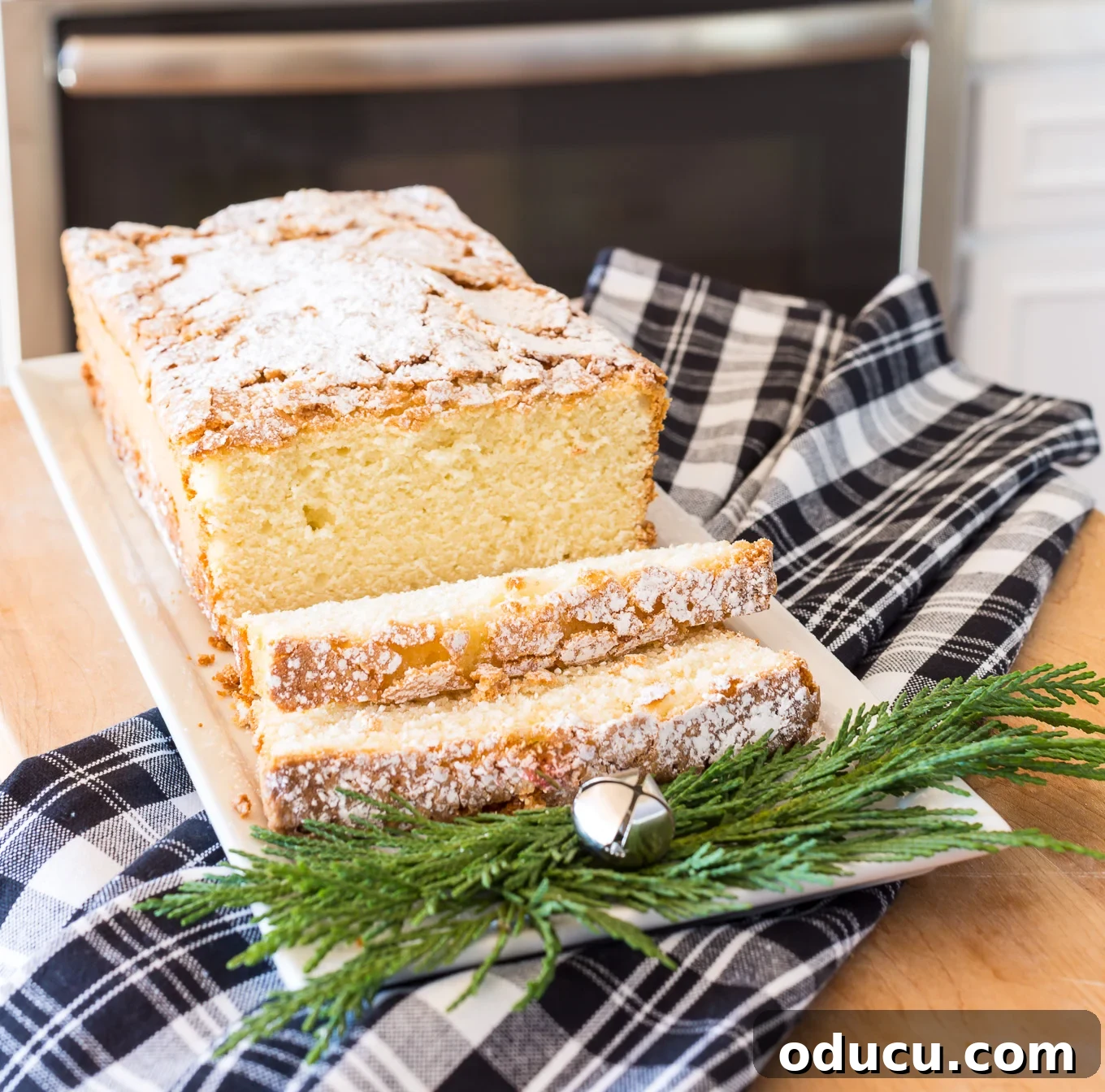 The Quintessential Old-Fashioned Lemon Pound Cake 3 Old Fashioned Lemon Pound Cake sliced on long white plate