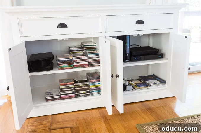 White buffet turned changed to into Tv wall mount furniture that will hold the TV components