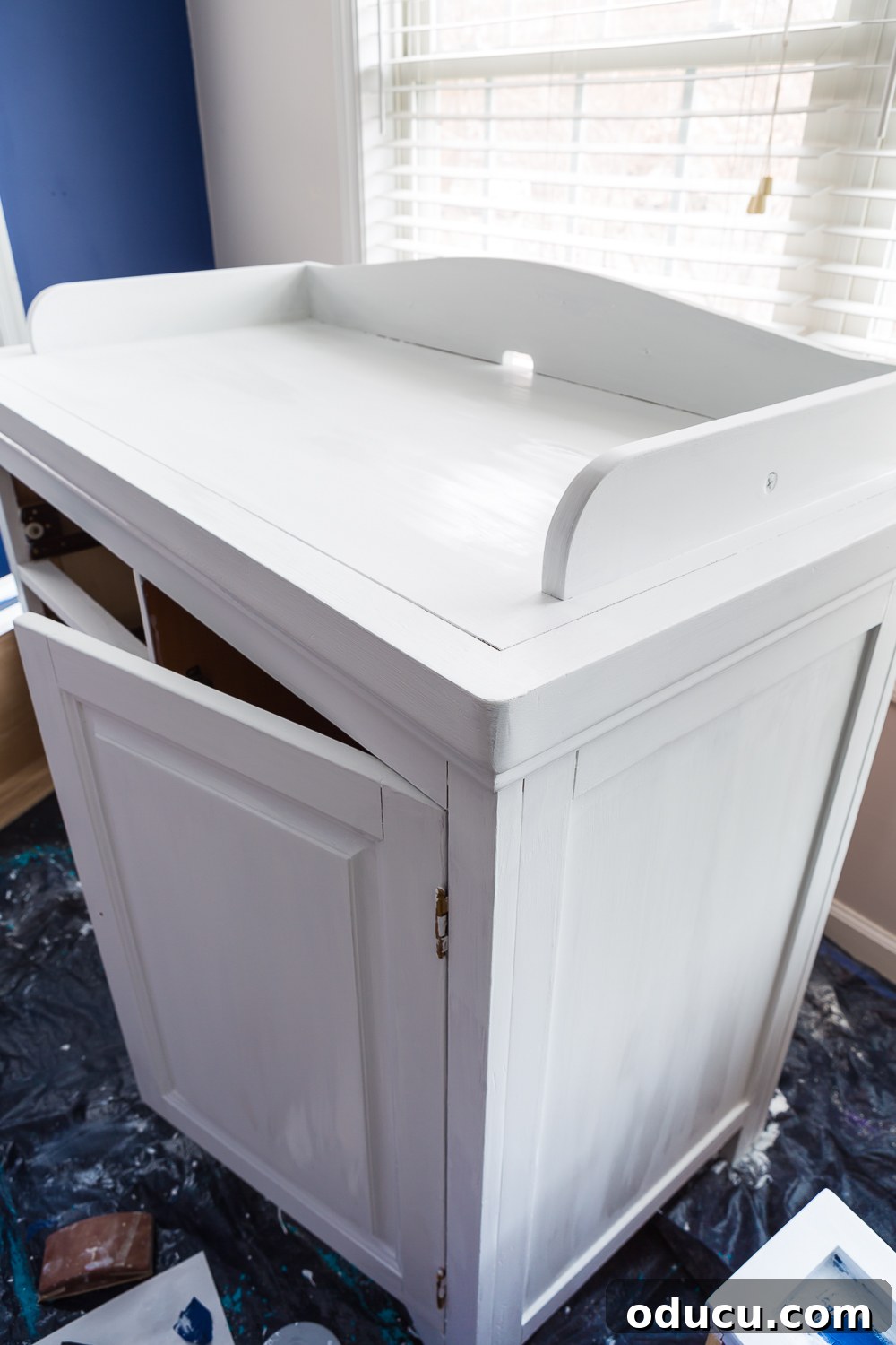 From Discarded to Dazzling: My Ultimate Furniture Upcycle 5 second hand furniture makeover of a Baby changing table that is still wet from getting a coat of white paint