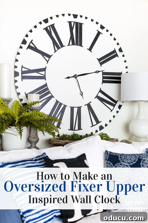 Are you a fan of the oversized wall clock that is actually a clock face in the Fixer Upper home of Chip and Joanna Gaines? I came up with a way to make my own large farmhouse wall clock to resemble it. #fixerupper #fixerupperstyle #WallClock #Blackandwhitedecor #DIYdecor A stunning DIY Oversized white clock, inspired by Fixer Upper homes of Chip and Joanna Gaines, showcasing a large farmhouse wall clock with black Roman numerals. Perfect for #fixerupper #fixerupperstyle #WallClock #Blackandwhitedecor #DIYdecor.