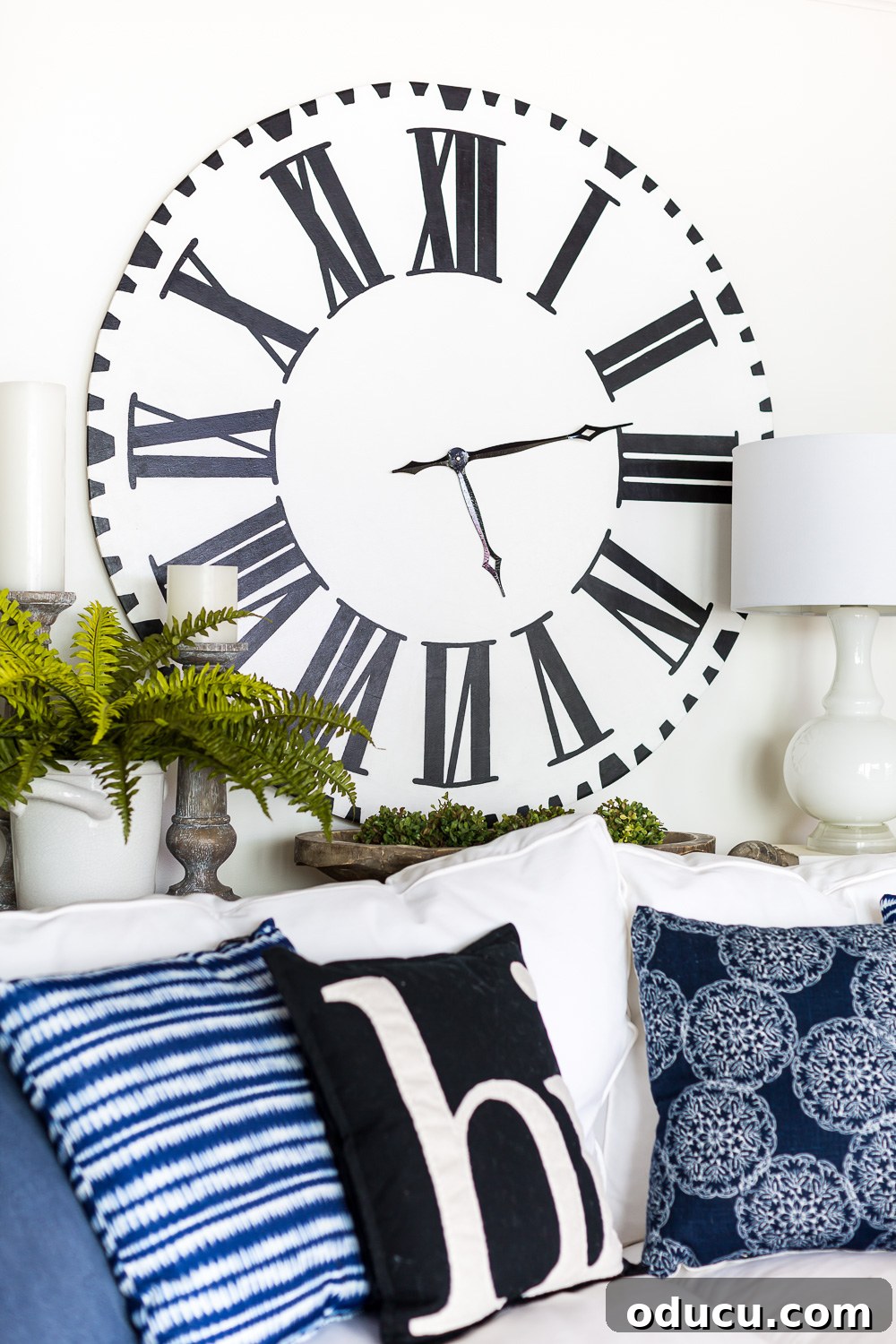 DIY Giant Farmhouse Wall Clock 3 Close-up of a beautifully finished DIY Fixer Upper Inspired Wall Clock with Roman numerals, showcasing the rustic farmhouse aesthetic.