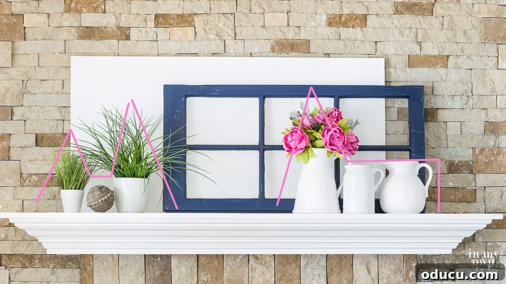 Creative mantel ideas Inspiring creative mantel ideas, showcasing a tightly grouped arrangement of decor items to create a cohesive and impactful focal point.