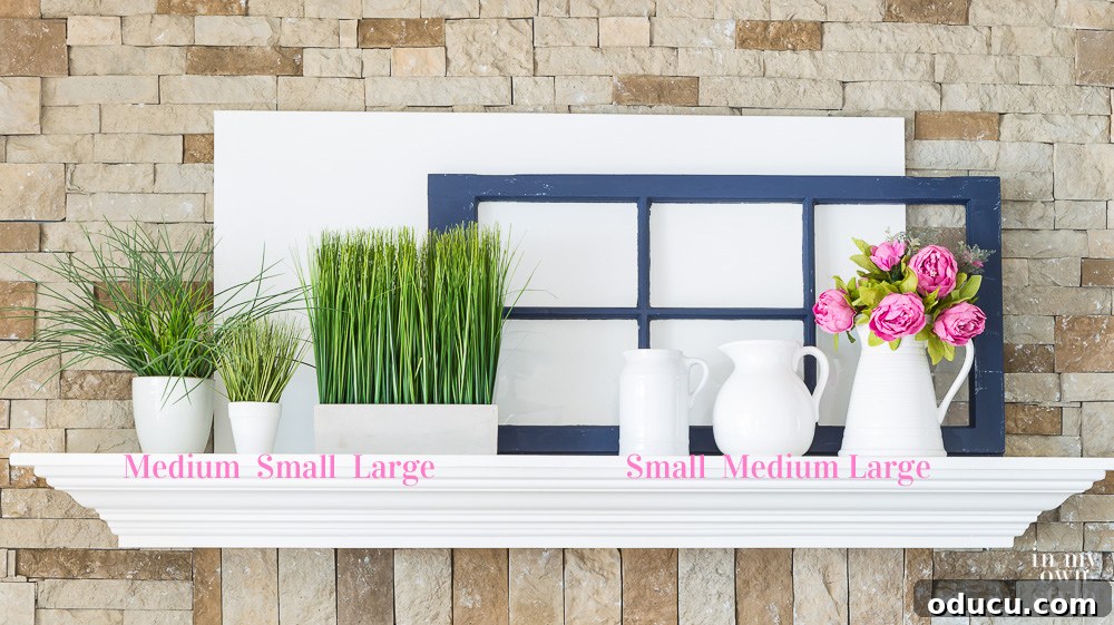 Decorating tips for fireplace mantels Practical decorating tips for fireplace mantels, illustrating how to create balance and rhythm by lining up three items on each side, with the largest strategically placed.
