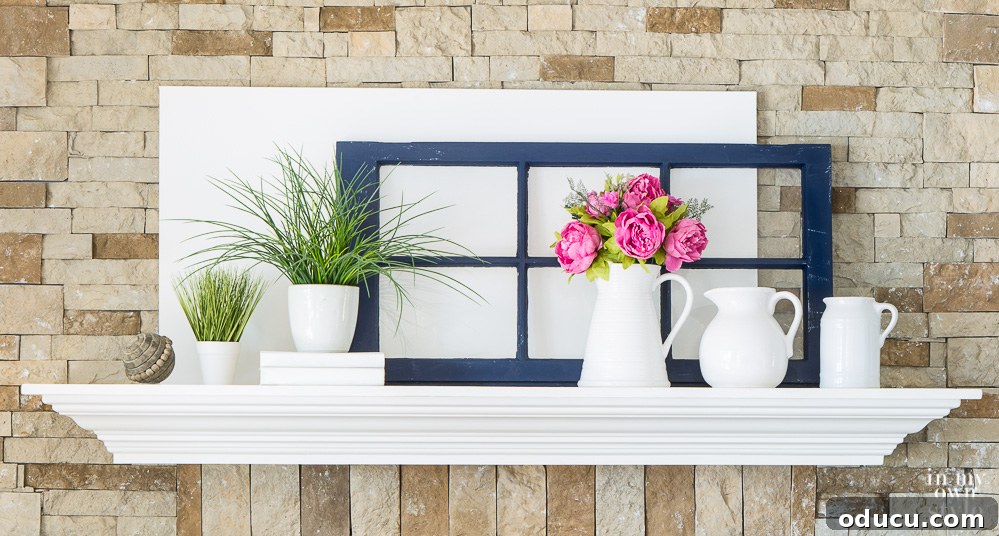 Fireplace mantel ideas and decorating tips Inspiring fireplace mantel ideas and decorating tips, demonstrating a refined and balanced arrangement that enhances the overall aesthetic of the living space.