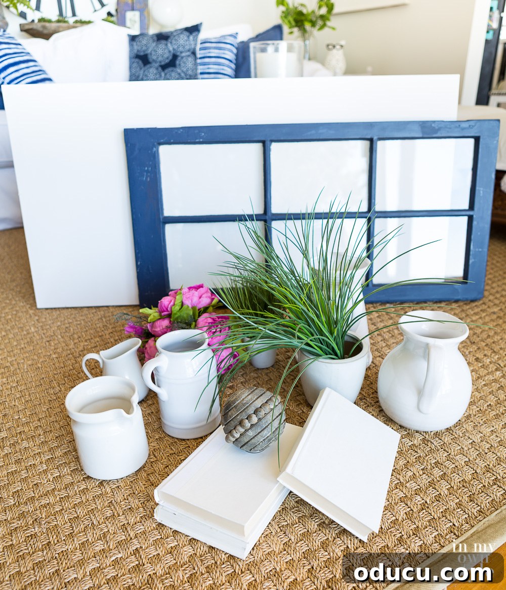 How to decorate a mantel like a designer does A curated collection of diverse items gathered for mantel decoration, emphasizing varied sizes, shapes, and textures for a dynamic display.