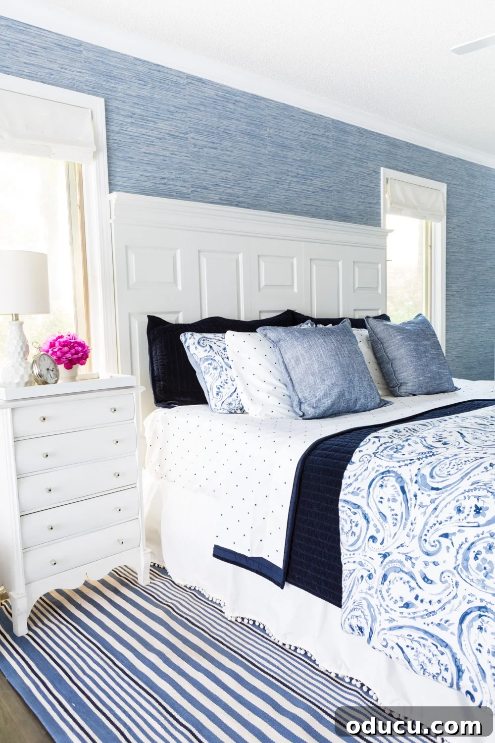 Embracing the SLOW Method for Mindful Decorating 3 Beautifully decorated bedroom showcasing a serene blue and white color palette