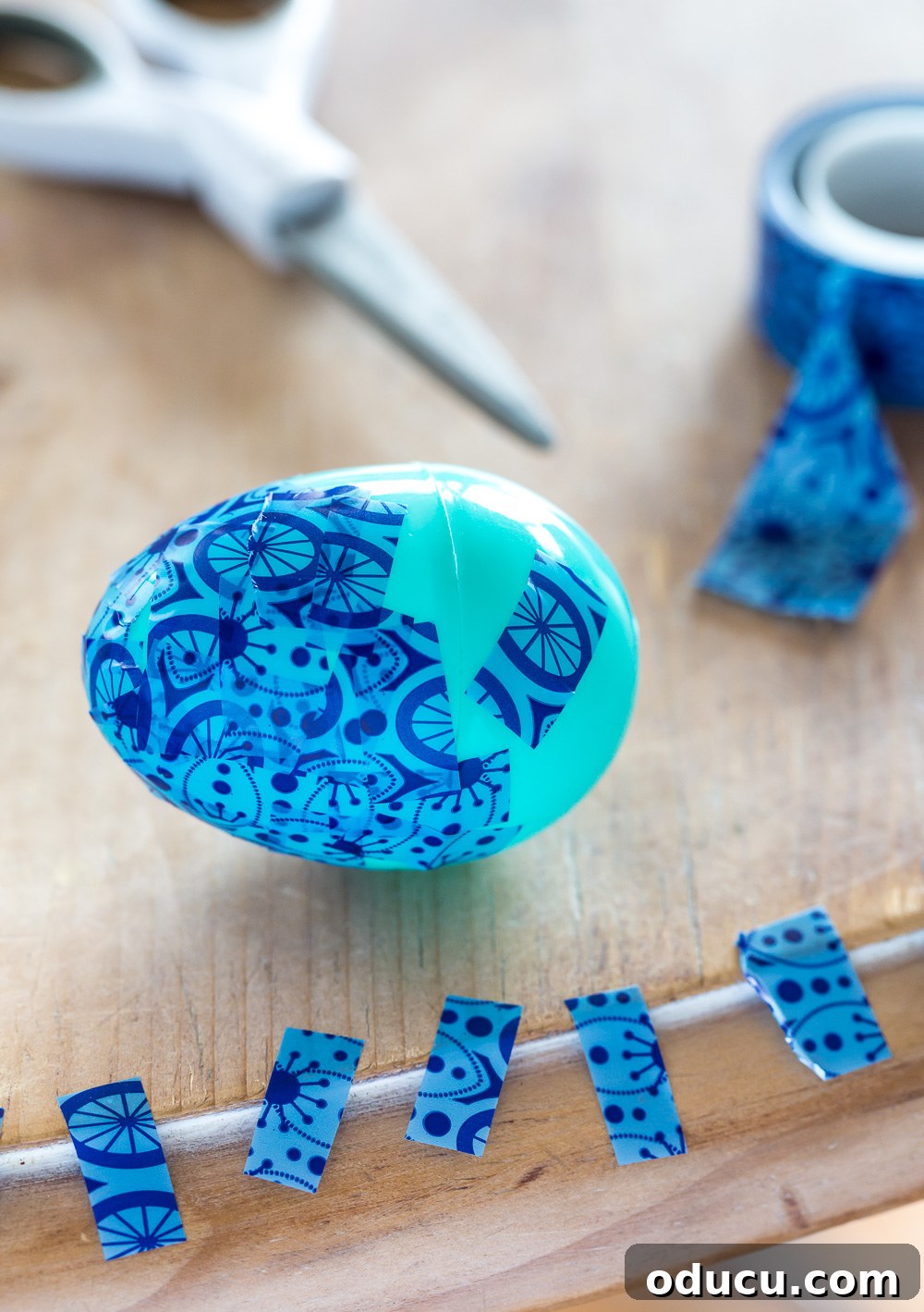 How to decorate Easter eggs the fast and easy way using Washi tape, showing small tape pieces.