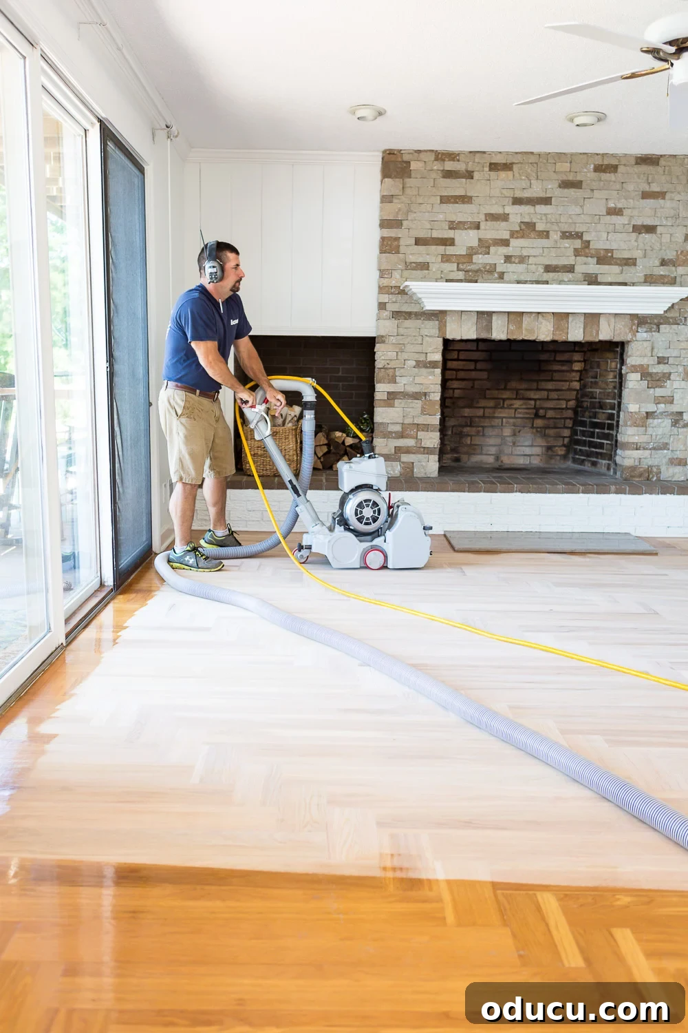 Bona professional floor refinisher sanding hardwood floor with a dustless system