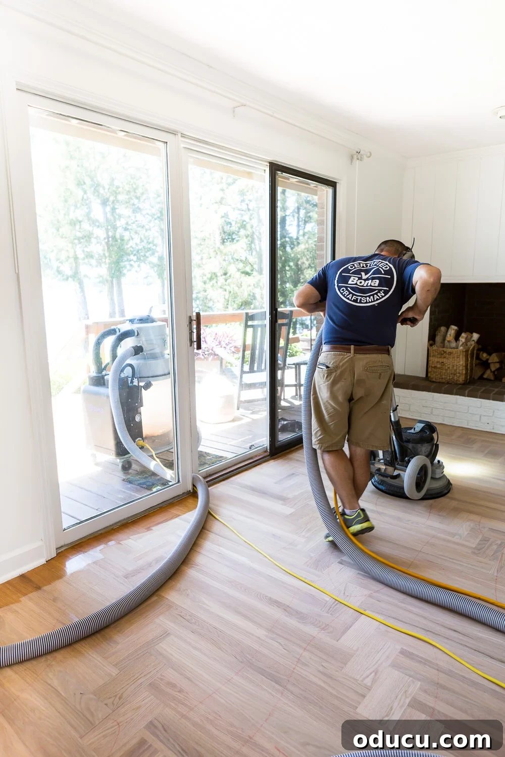 Bona hardwood floor professional meticulously sanding for stain and finish prep