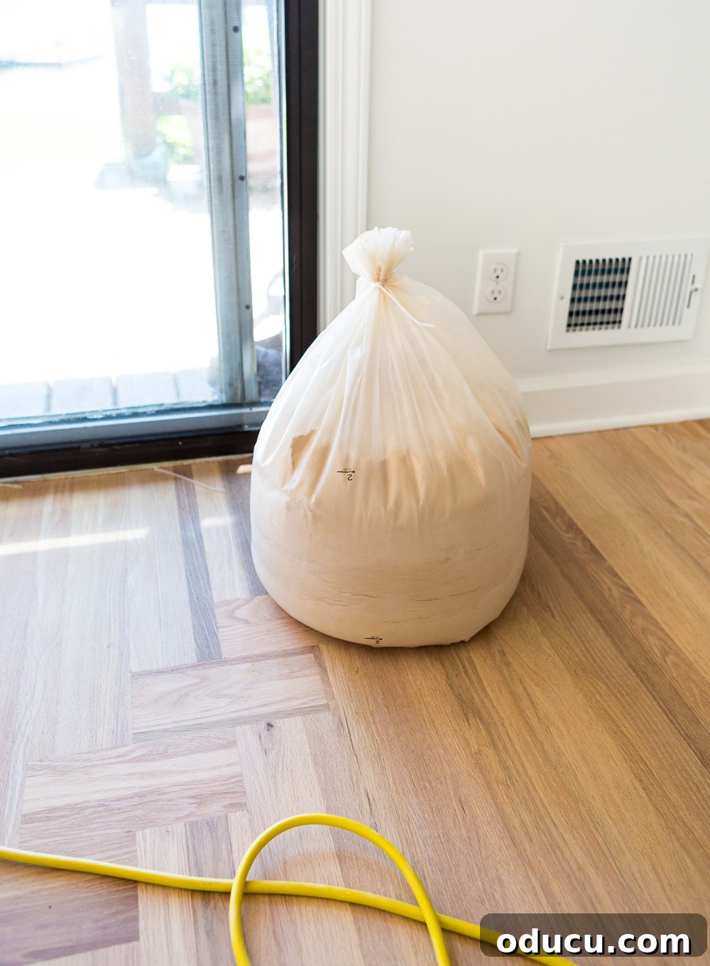 Bagged sanding dust from Bona's dustless system, no mess in home
