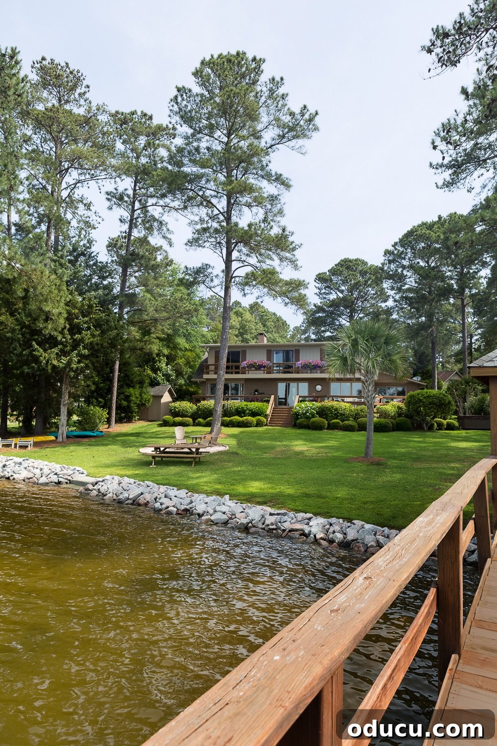 From Faded to Flawless: Exterior Home Painting 14 Lake house painted in Glidden premium paint in the color Khaki Bronze