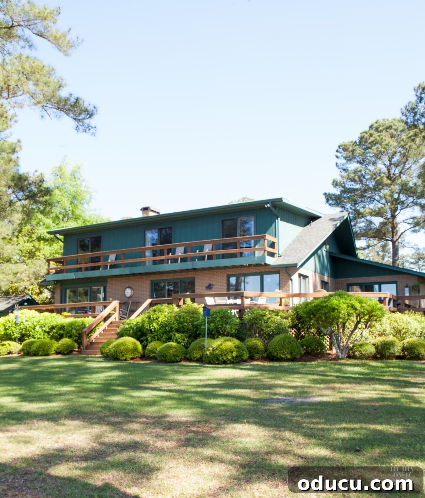 From Faded to Flawless: Exterior Home Painting 8 Faded teal paint on brick lake house that got a makeover.