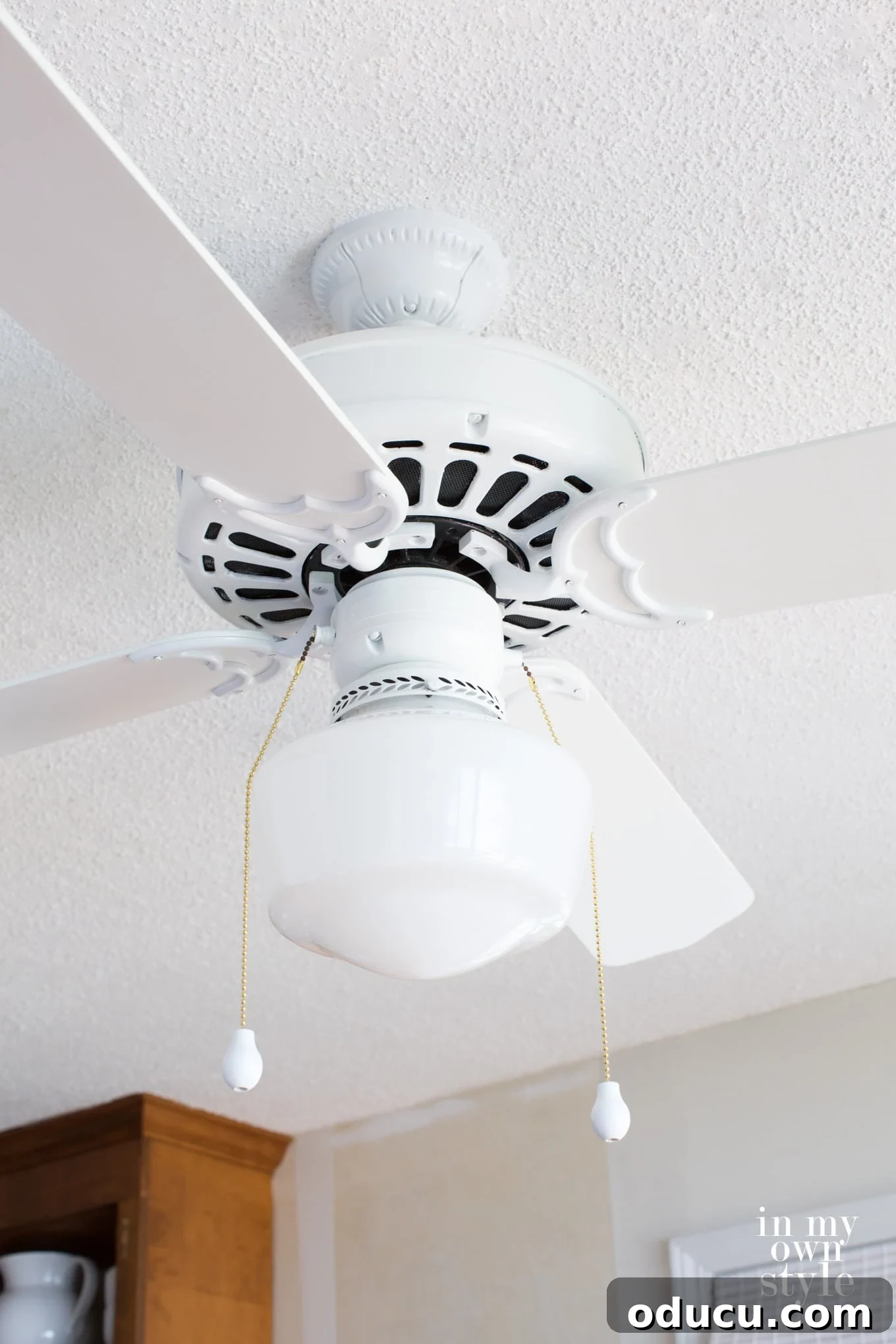 The Soul of Home: Found in the Little Things 8 An example of how to affordably upgrade an old ceiling fan, focusing on uniform pull chains for a cohesive home aesthetic.