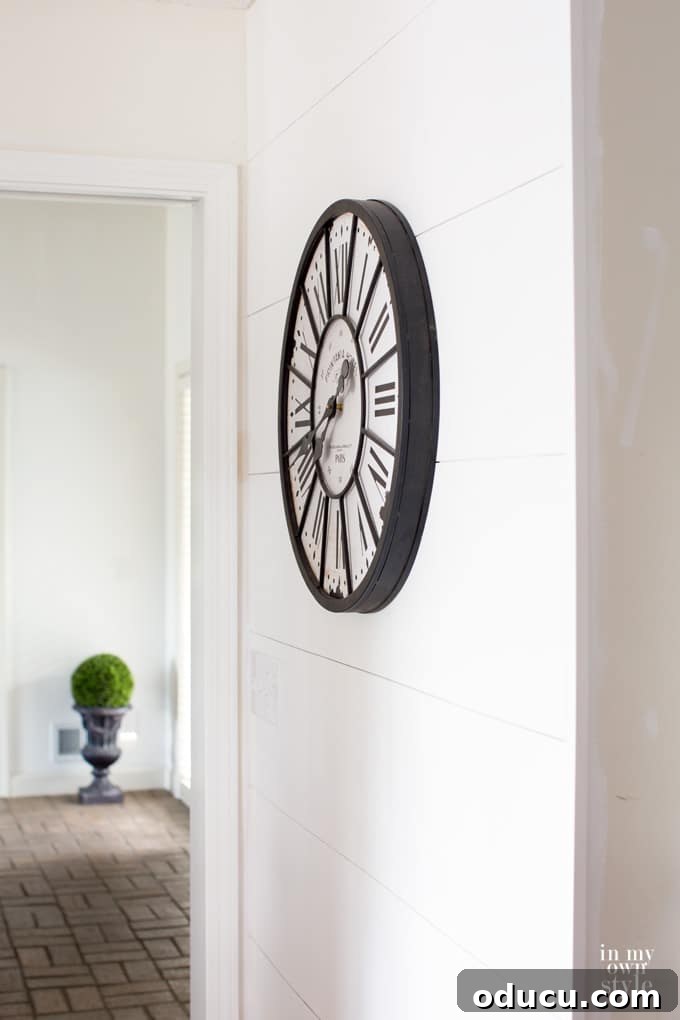 One Wall, Big Impact 2 DIY shiplap wood planked accent wall in hallway, joining kitchen, foyer, and hallway