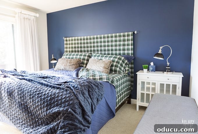 One Wall, Big Impact 3 Navy blue paint on an accent wall in a bedroom