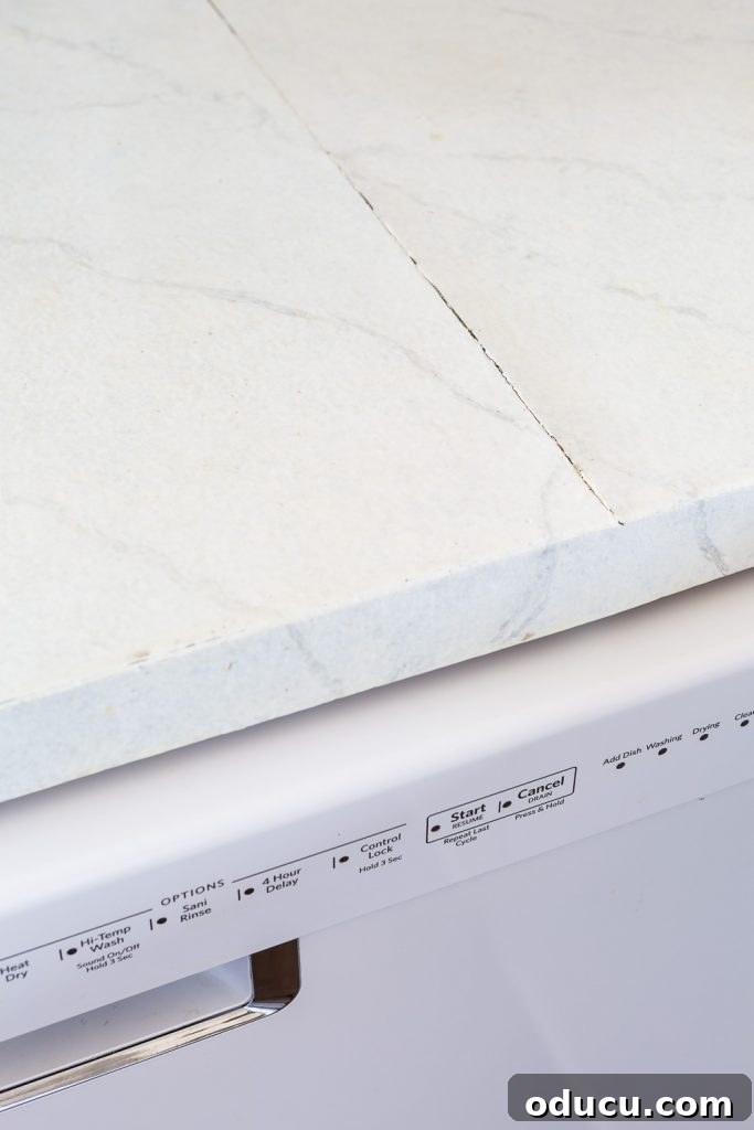 Still Relevant 16 Seam in painted Formica is cracking after 1.5 years due to heat from dishwasher