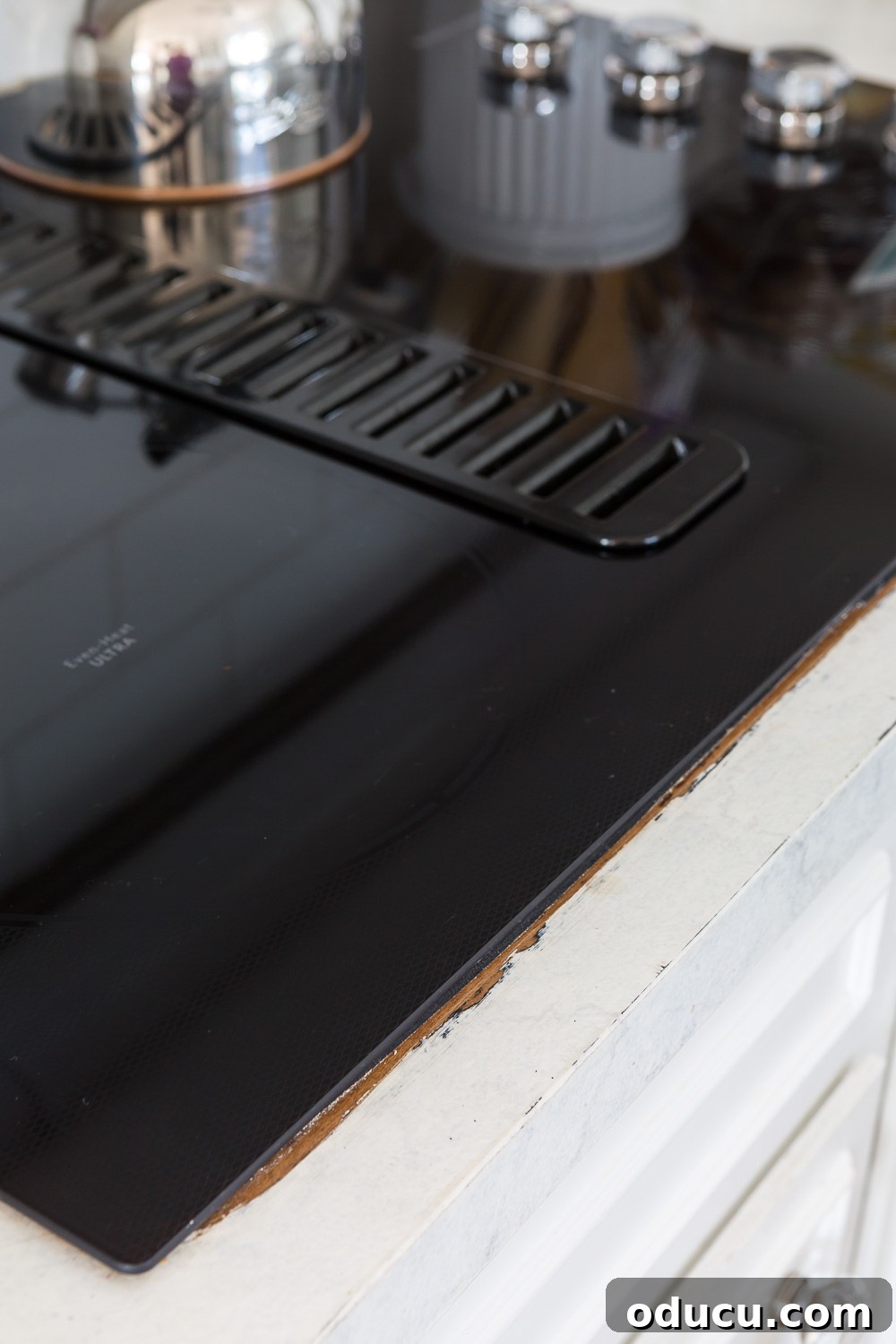Still Relevant 17 Painted counter showing exposed original Formica after a new cooktop was installed, requiring a fix