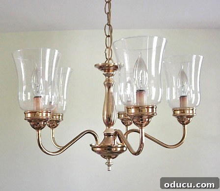 Still Relevant 20 Before image of a plain brass dining room chandelier