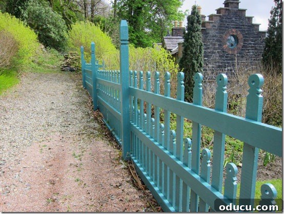 Ireland-Kylemoor-Abbey-Fence A vibrant turquoise fence contrasting beautifully with the green Irish landscape at Kylemore Abbey