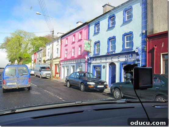 Ireland-towns A charming street lined with colorful houses and shops in a quaint Irish town