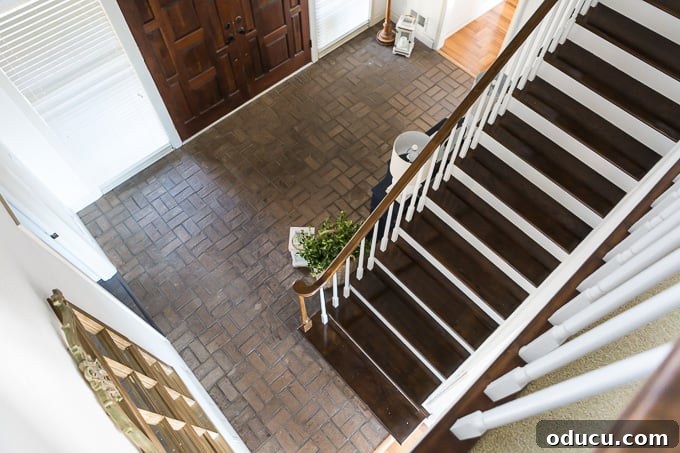 My $14 Whitewashed Brick Floor Makeover 2 Brown brick floor in foyer of home before whitewashing