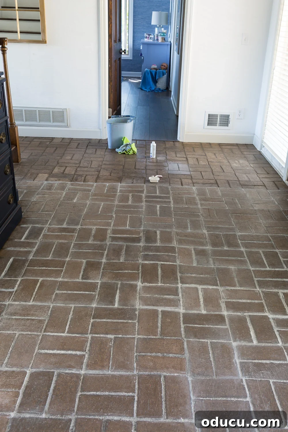 My $14 Whitewashed Brick Floor Makeover 10 The how to tutorial showing the process of how to add a layer of color wash in this case white over a brick floor.