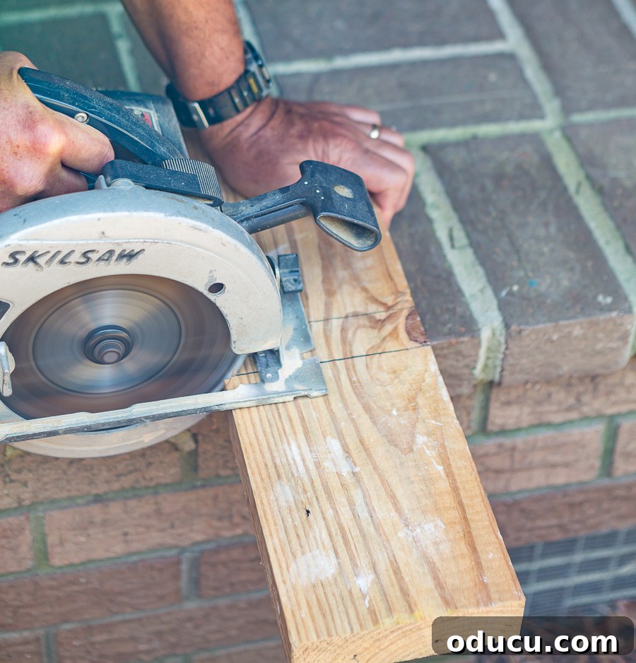 cutting a block from a 2 x 6 wood board