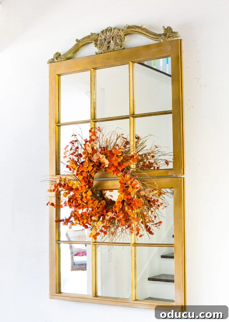 Autumn Nesting: Decor Ideas for Fall 12 DIY window sash mirror in the foyer adorned with a fall wreath from last year