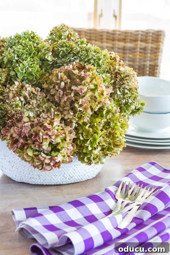Autumn Nesting: Decor Ideas for Fall 13 Low dried hydrangea arrangement in a collapsible basket for a dining table