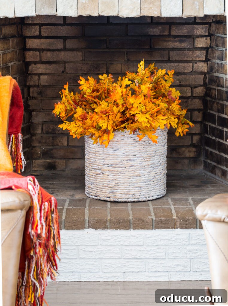 Autumn Nesting: Decor Ideas for Fall 6 Fireplace filled with a basket of autumn leaves, waiting for cooler weather