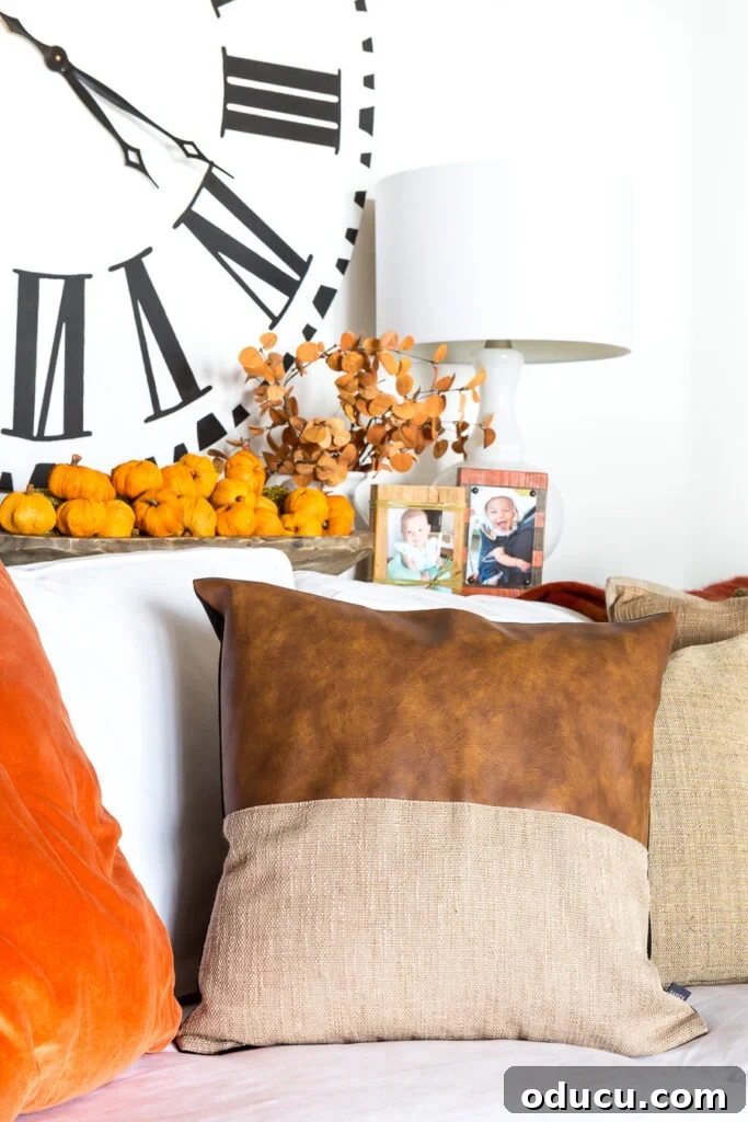 Autumn Nesting: Decor Ideas for Fall 7 Affordable leather throw pillow on sofa, balancing leather recliners in the room
