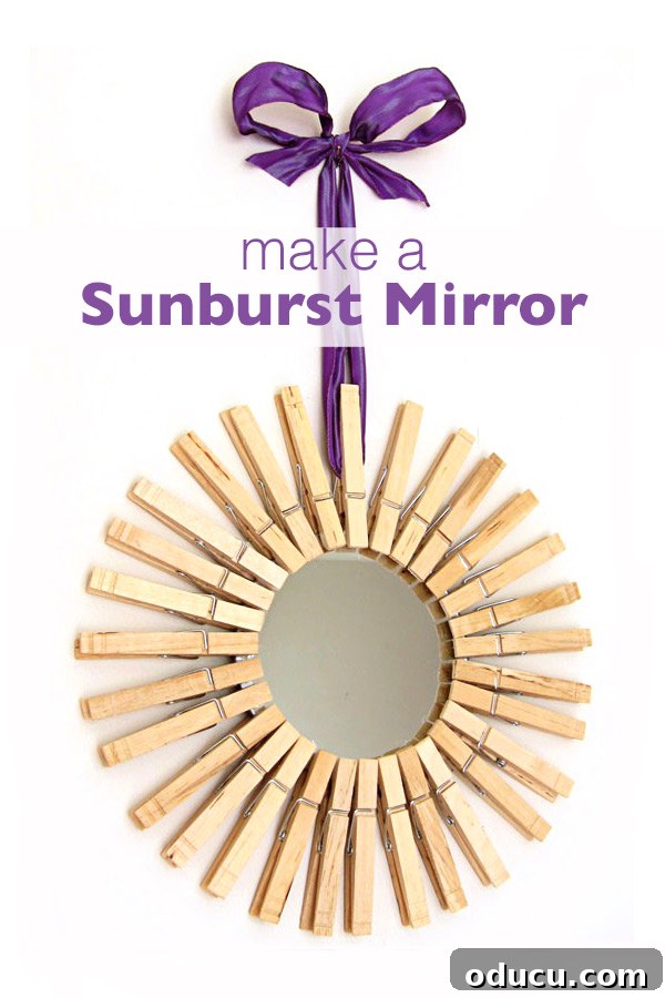 How to make a decorative sunburst mirror using dollar store mirrors and clothespins. #dollarstore #sunburstmirror #starburstmirror #DIYdecor #makeit #repurposeclothespins #clothespinart #clothespins #giftideas Mirror framed in clothespins and hung with purple ribbon
