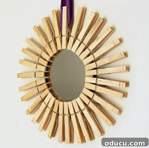 How to make a DIY sunburst mirror using clothespins closeup image of DIY clothespin mirror