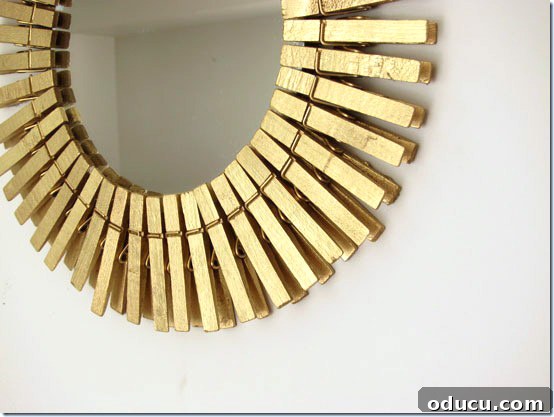 How to make a gold sunburst mirror using clothespins and spray paint. Gold-Sun burst-Mirror-made-using-clothespins