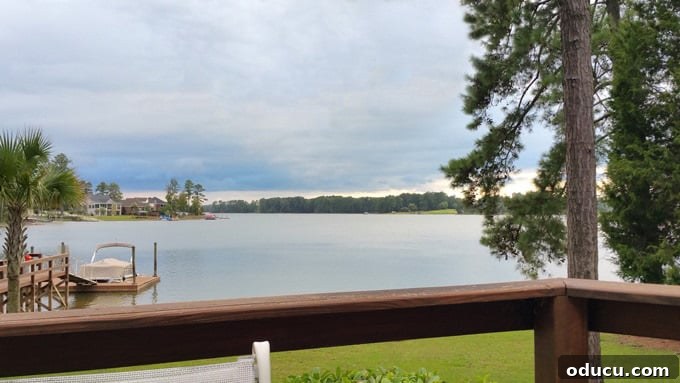 Style Expeditions Vol 8 2 Lake house view of water on stormy day, reflecting a serene yet powerful atmosphere.